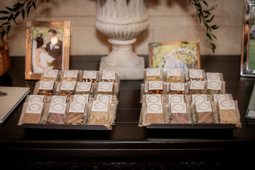 Favor bags arranged with framed couple photos