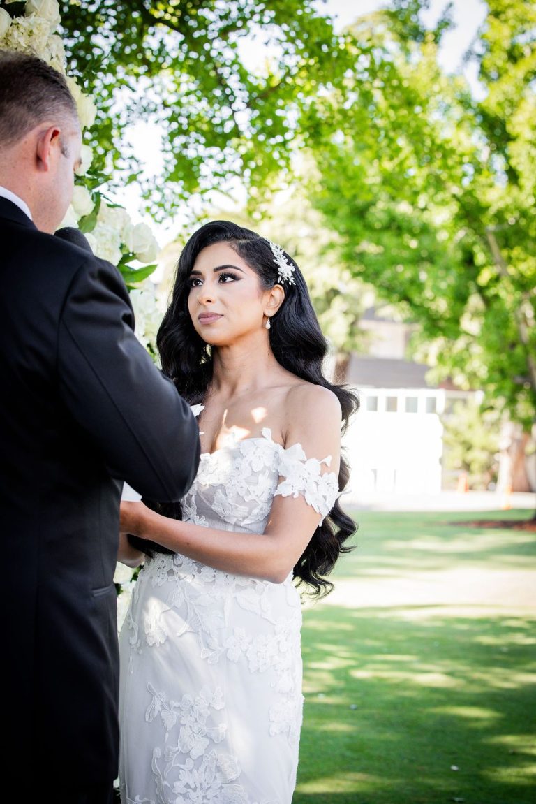 Bride gazing at groom during intimate vow moment