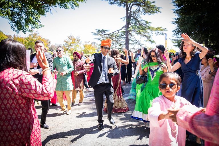 Child dances in front as guests celebrate behind