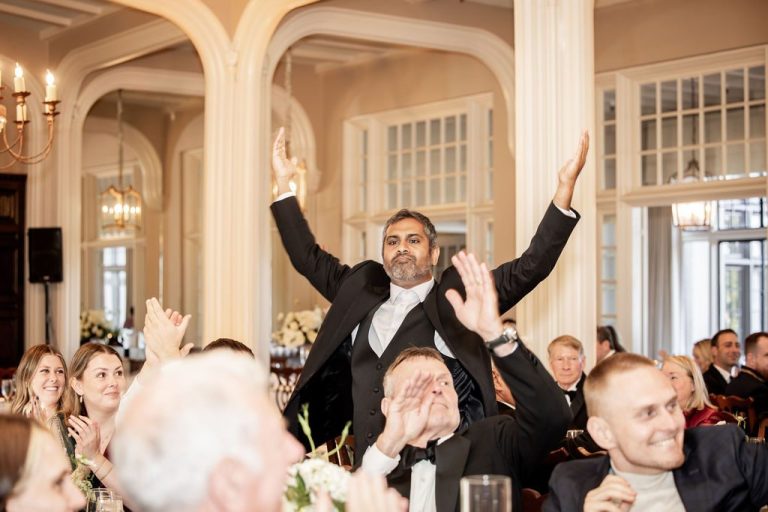 Guest lifted with arms raised during reception entrance