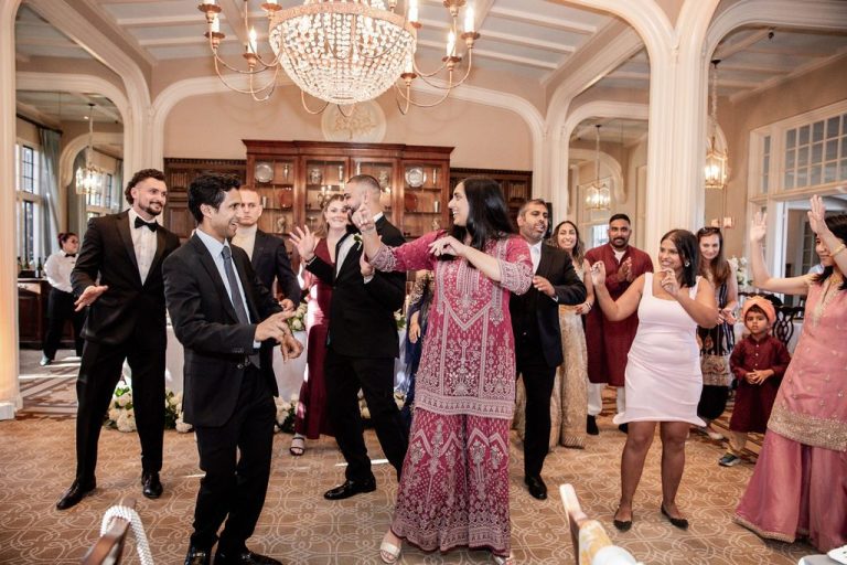 Guests performing choreographed dance in colorful attire