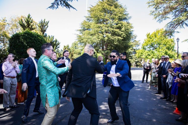 Men dancing during lively outdoor celebration