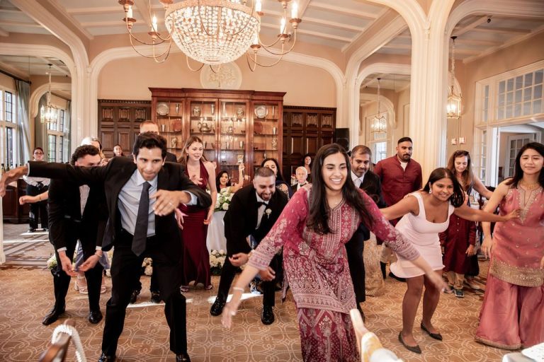 Guests mid dance move on reception floor
