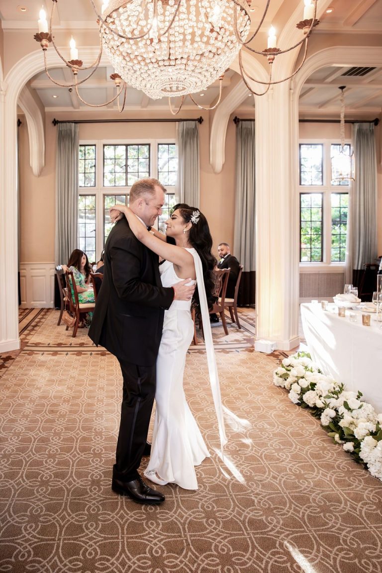 Bride and groom embracing during first dance