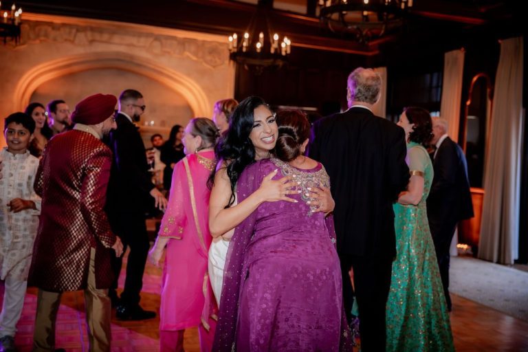 Guests dancing joyfully in colorful traditional attire