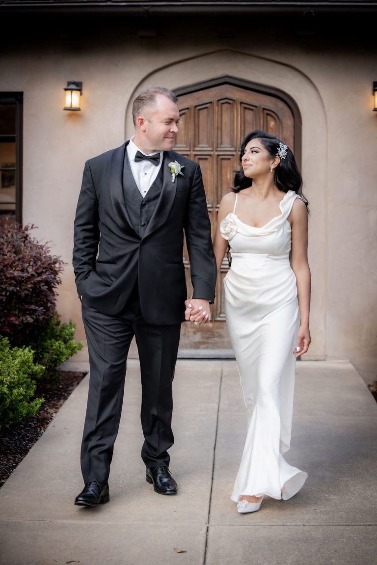 Bride and groom walking and gazing lovingly, warm light