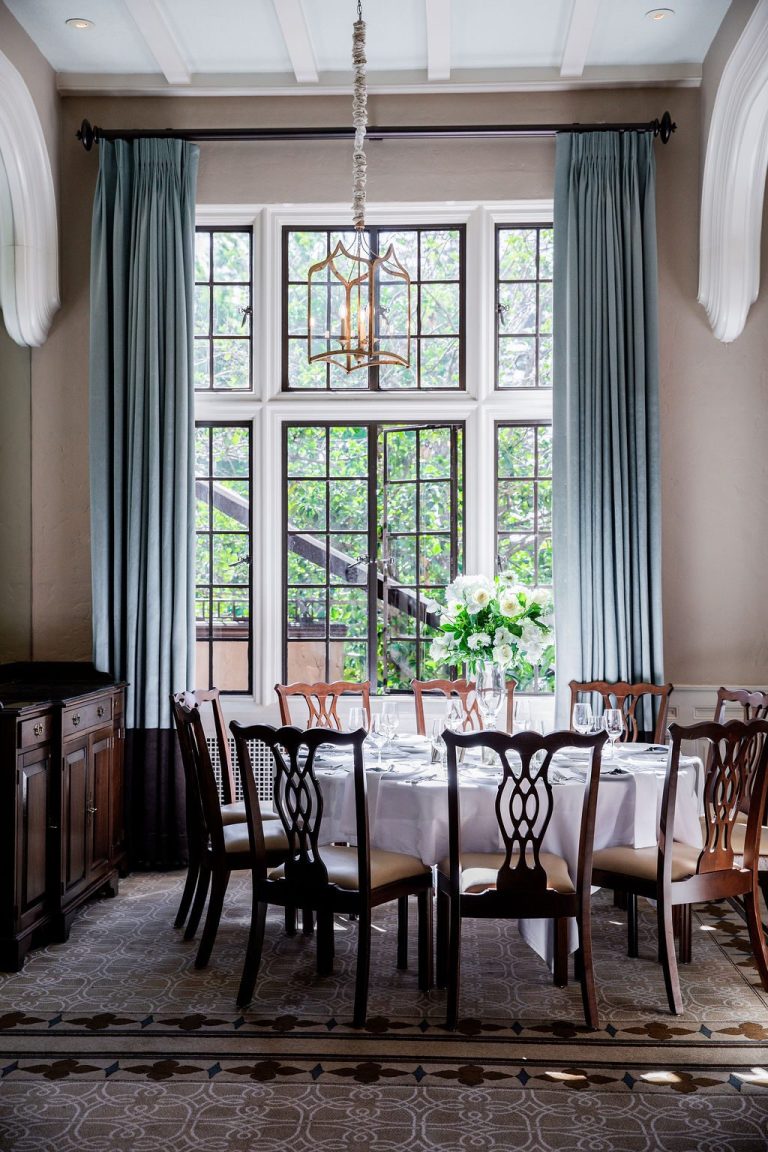 Intimate dining nook with round table by window