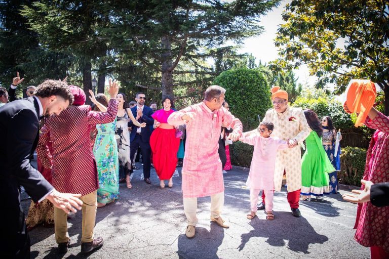 Family and children dancing in celebratory procession