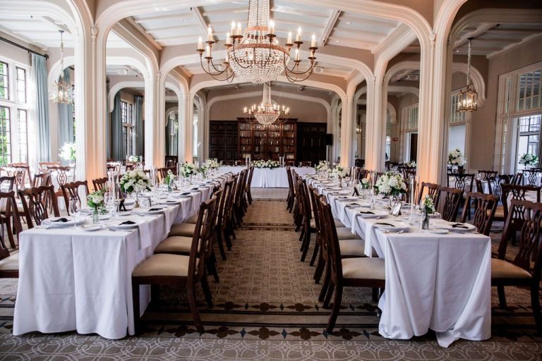 Grand hall with chandeliers and long banquet tables
