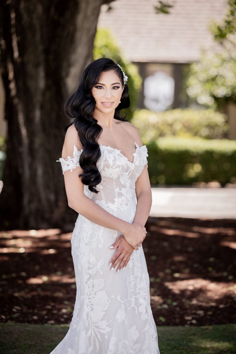 Elegant bride portrait with curls under trees