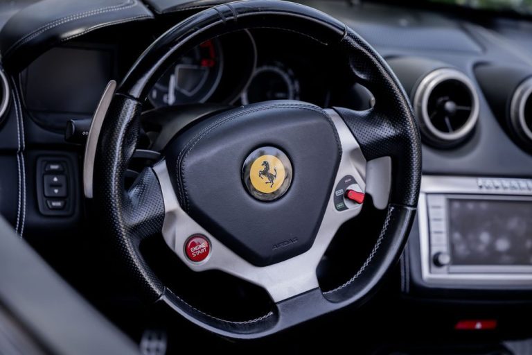 Close up of sports car steering wheel and dash