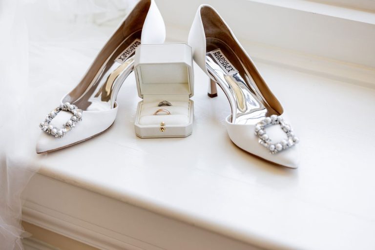Jeweled bridal heels flanking open ring box