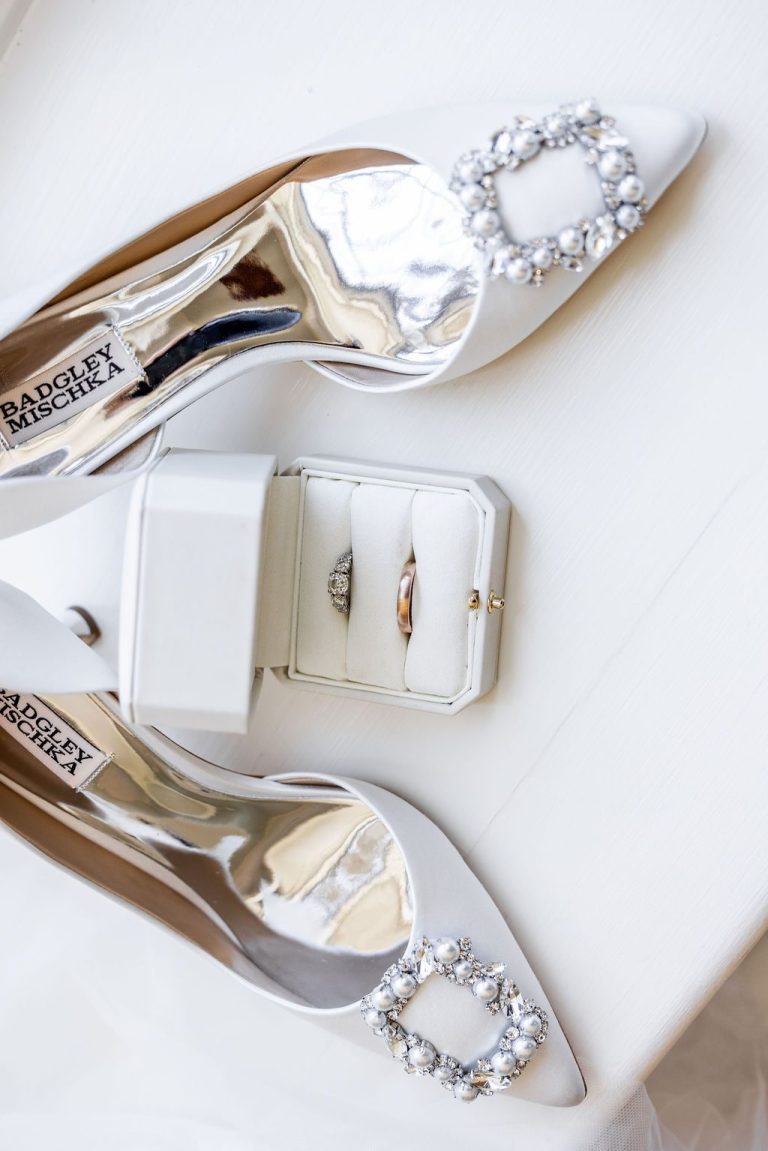 Bridal heels flanking ring box overhead flatlay