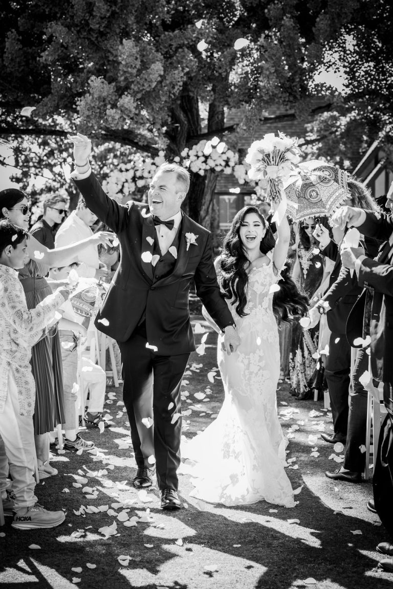 Black and white celebratory recessional with raised arms