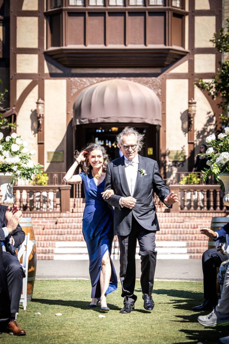 Couple descending steps into aisle, near duplicate