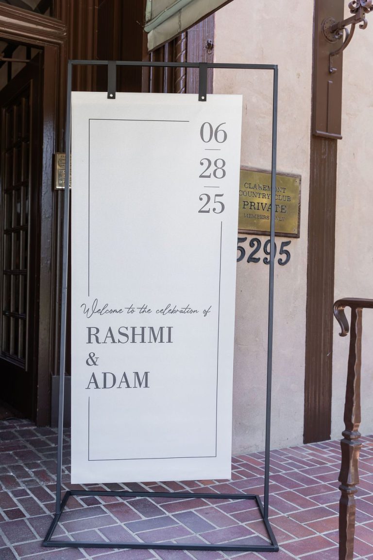 Welcome sign reading Rashmi and Adam with date