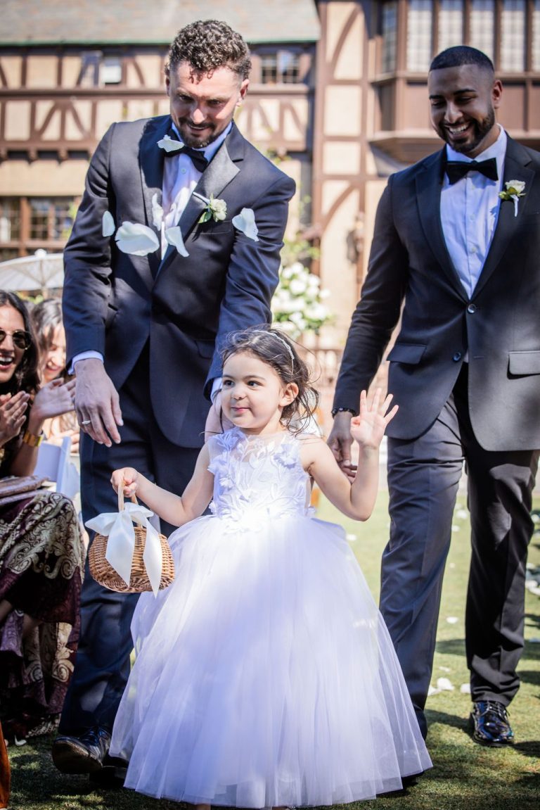 Groomsmen and flower girl walking aisle, near duplicate