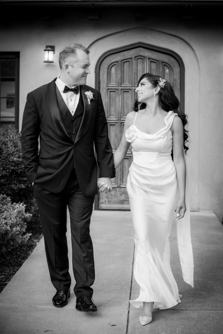 Black and white couple walking hand in hand